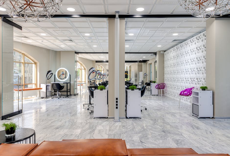 A sleek and modern beauty salon featuring chic design and comfortable seating areas.