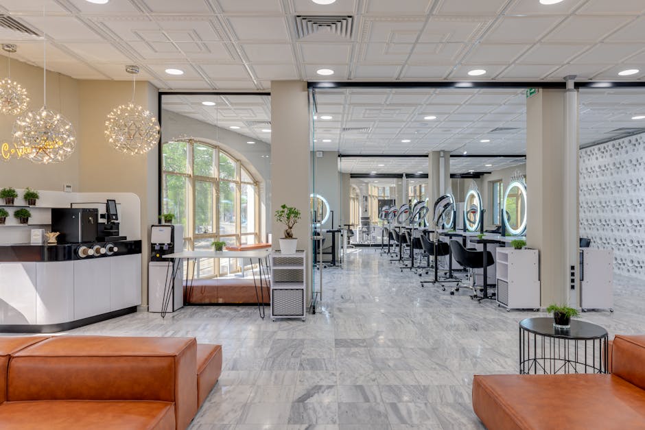 Spacious and modern beauty salon interior with stylish decor and lighting.