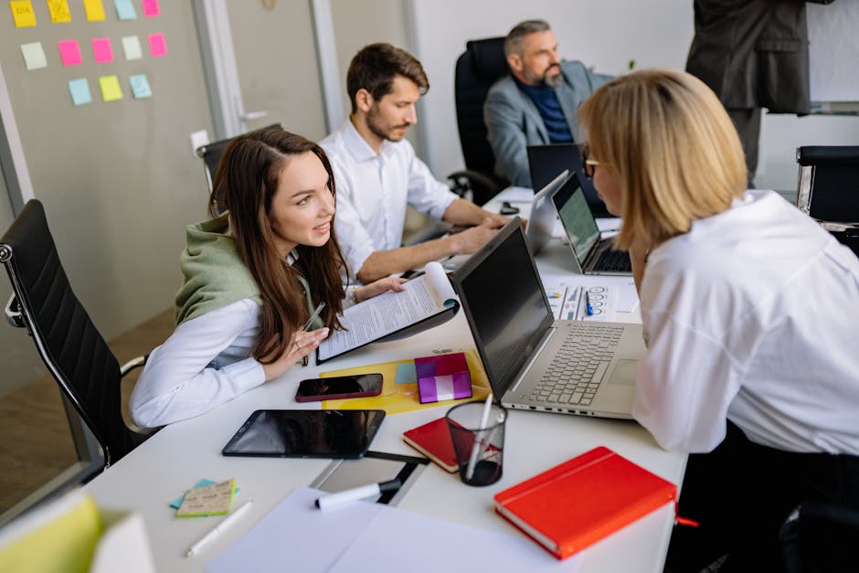 Team discussion in a modern office setting, focusing on cooperation and strategy development.