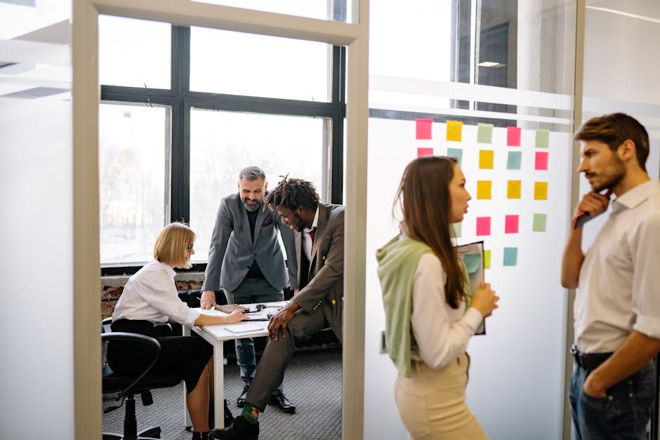 A diverse team collaborating in a modern office, discussing ideas and strategies.