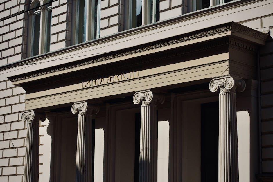 Majestic Neoclassical facade featuring ornate columns and classical architecture.