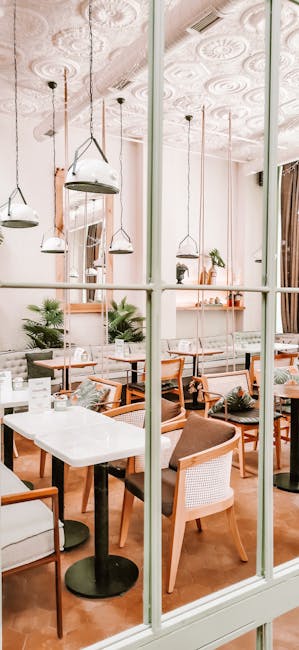 Elegant restaurant interior featuring chic modern furnishings and decorative elements.