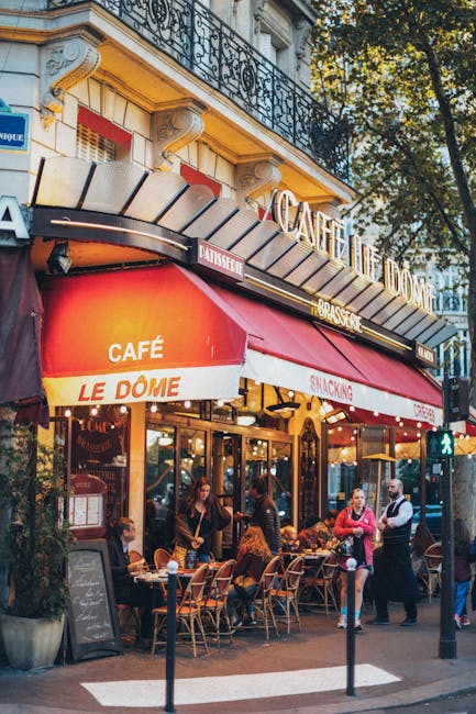 Bustling Parisian café with people dining outdoors, vivid and inviting atmosphere.