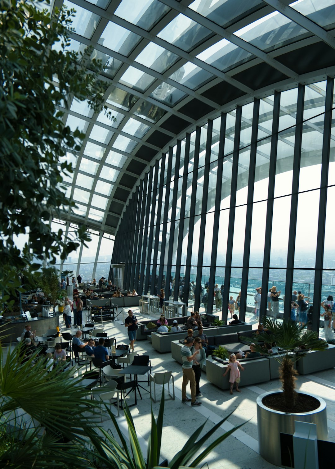 A group of people standing inside of a building