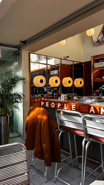 Cozy modern cafe interior with retro lighting and decor, creating a warm, inviting space.