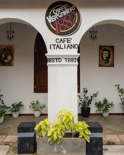 Elegant exterior of Caffe Vergnano 1882 with Italian style decor and plants.