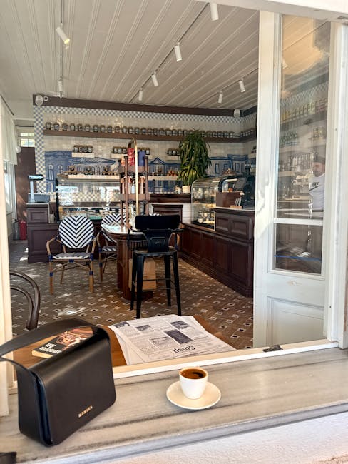 Cozy café interior with a cup of espresso, inviting chairs, and decorative tiles.