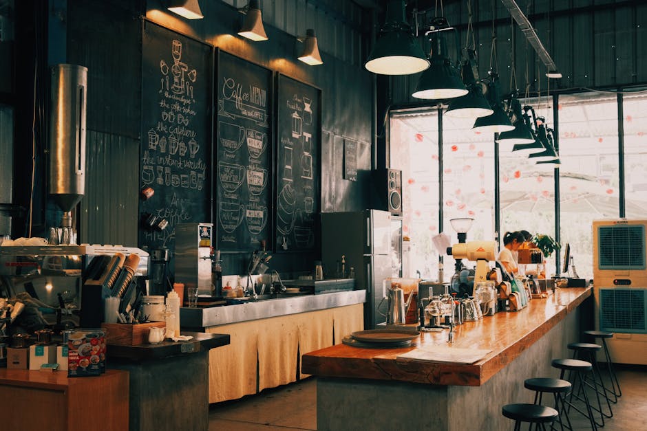 A warm, rustic coffee shop with a wooden counter and chalkboard menu, offering a cozy atmosphere.