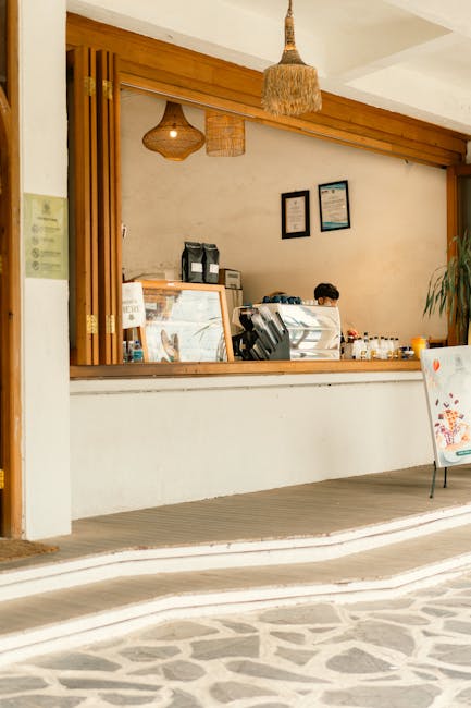 Cozy cafe counter in Surabaya with wooden decor and warm lighting, offering a welcoming atmosphere.