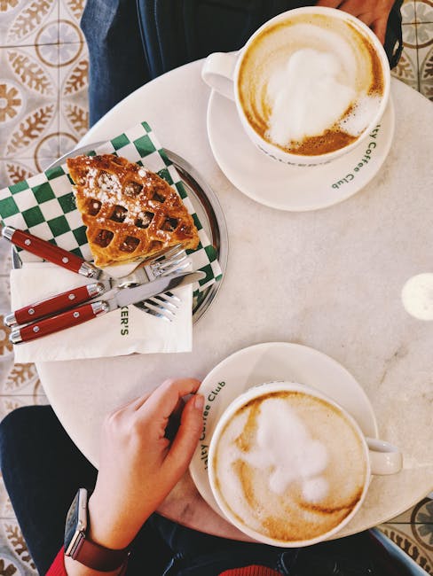 Warm café scene in Ankara with cappuccinos and Belgian waffle, perfect for a cozy brunch.