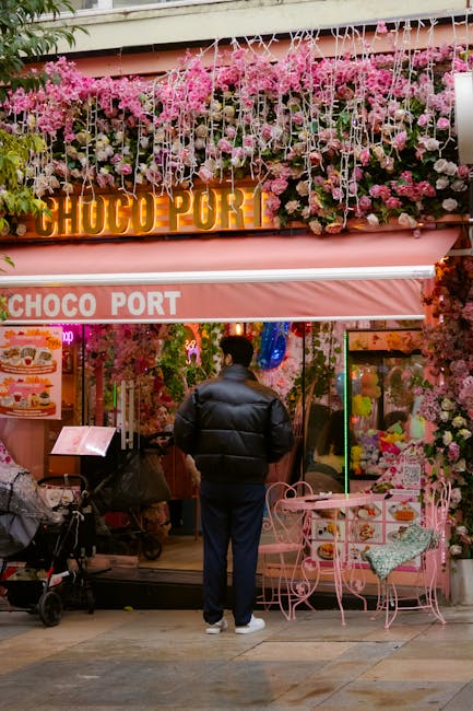 A vibrant cafe adorned with pink flowers and decor in Istanbul, Türkiye.