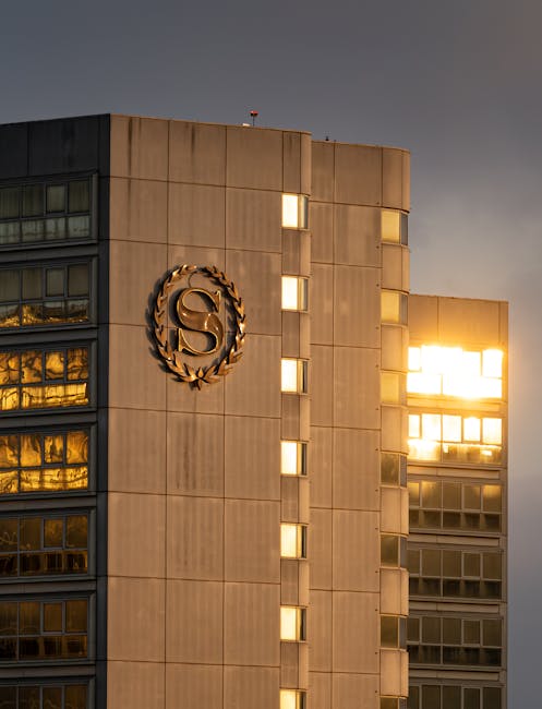 Sheraton Hotel in Los Angeles with dramatic sunset reflections on windows.