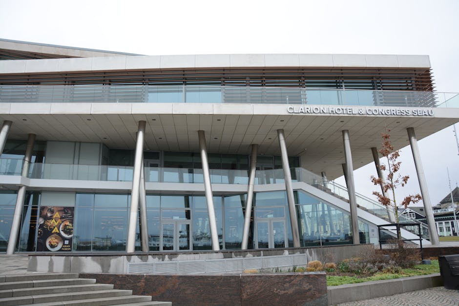 Front view of Clarion Hotel showcasing modern design and glass facade.