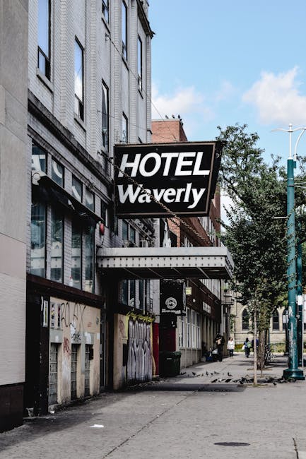 Street view of the historic Hotel Waverly facade in Toronto, showcasing urban architecture and vintage design.