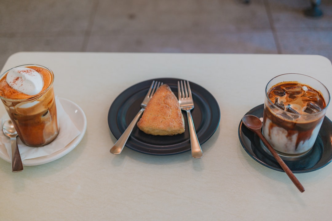 Two iced coffees and pastry on a table