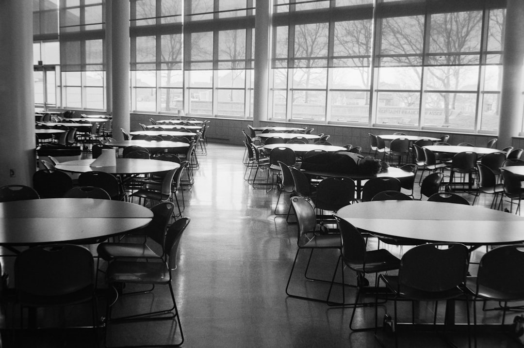 Empty cafeteria with round tables and chairs