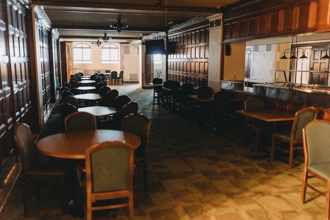 An empty dining room with wooden accents.