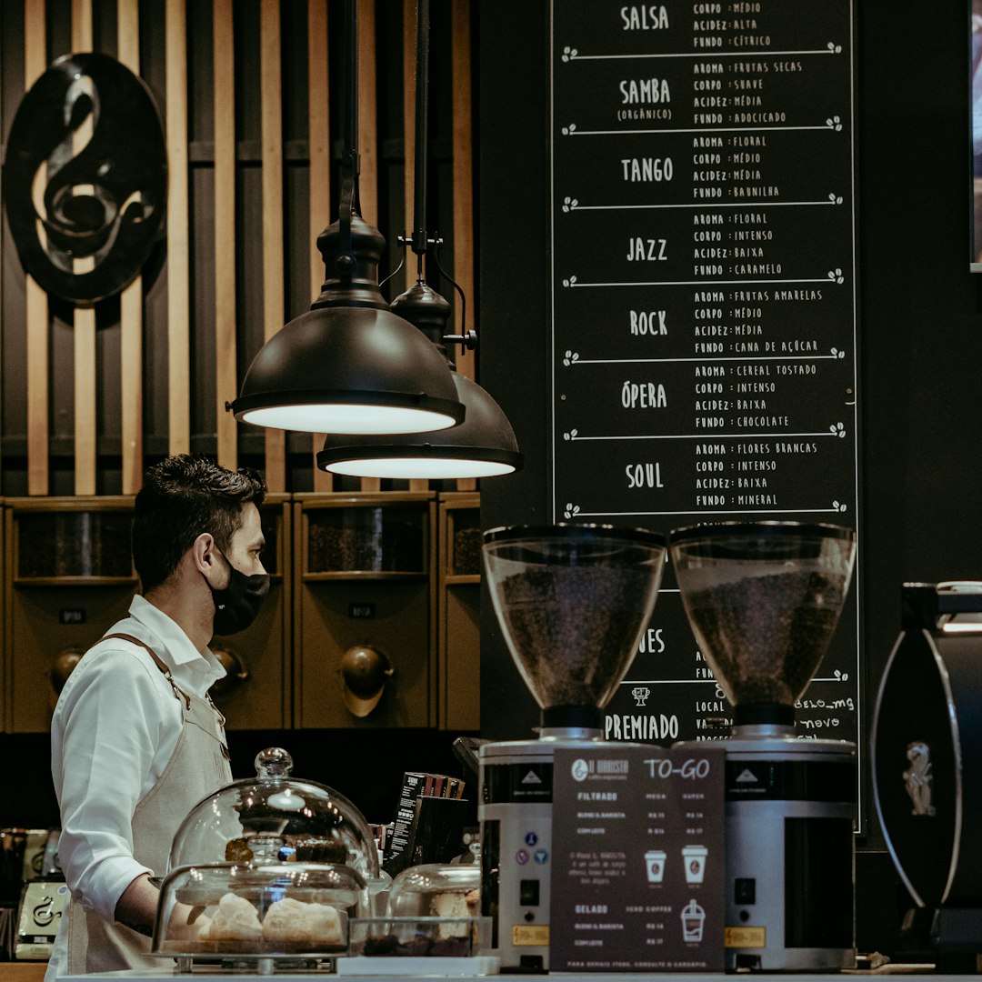 a man standing next to a display