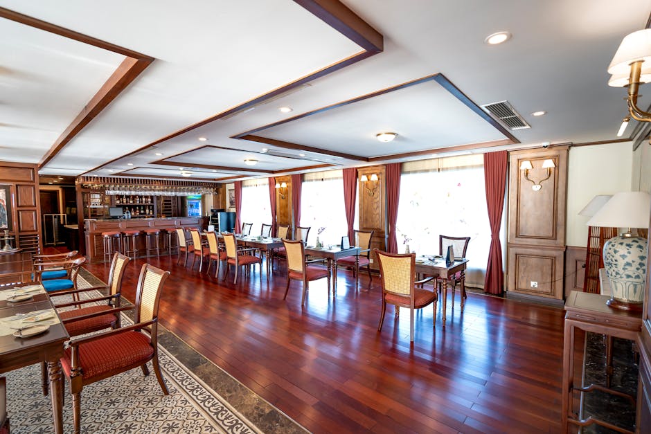 Luxurious and spacious restaurant interior with elegant wooden design and decor.