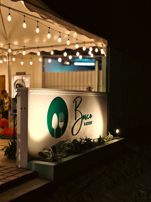 Cozy outdoor dining area in Bengaluru with warm lights and atmospheric ambiance at night.