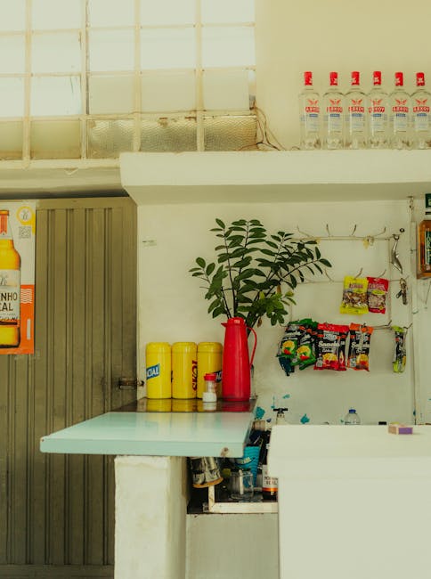 Charming indoor bar setup with colorful drinks and snack display, capturing an inviting atmosphere.