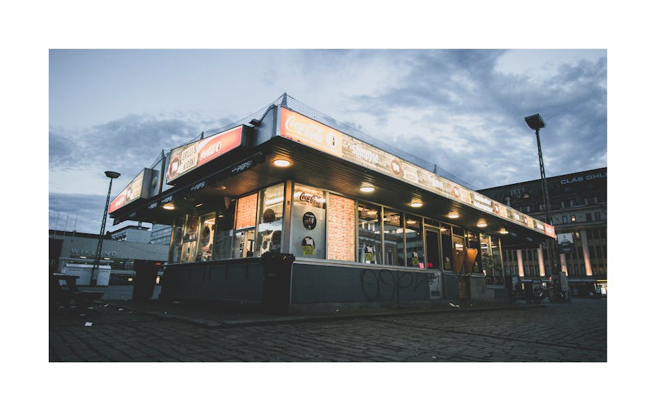 Street view of a grill kiosk in Helsingfors, Finland during twilight.