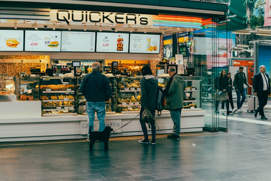 Customers gather at a bustling food stall in Frankfurt, capturing urban life.