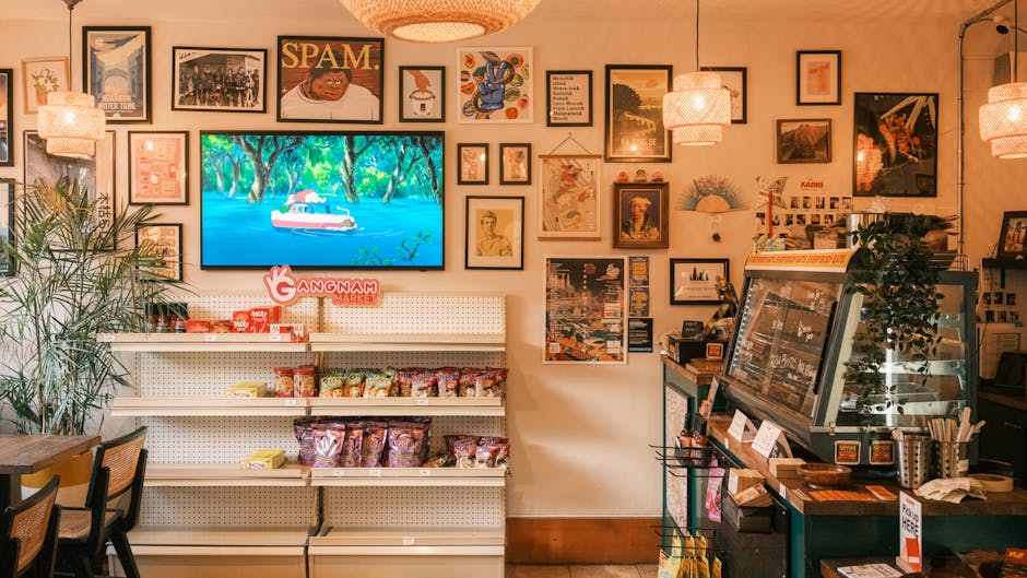 A vibrant Korean market interior featuring snacks, decor, and art pieces on display.